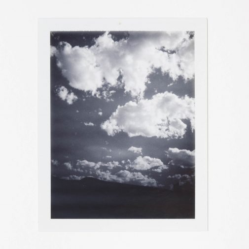 Black and white clouds photographed on Polaroid Land Camera.