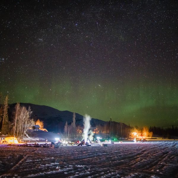 The aurora borealis dances over the dog lot at Finger Lake checkpoint.