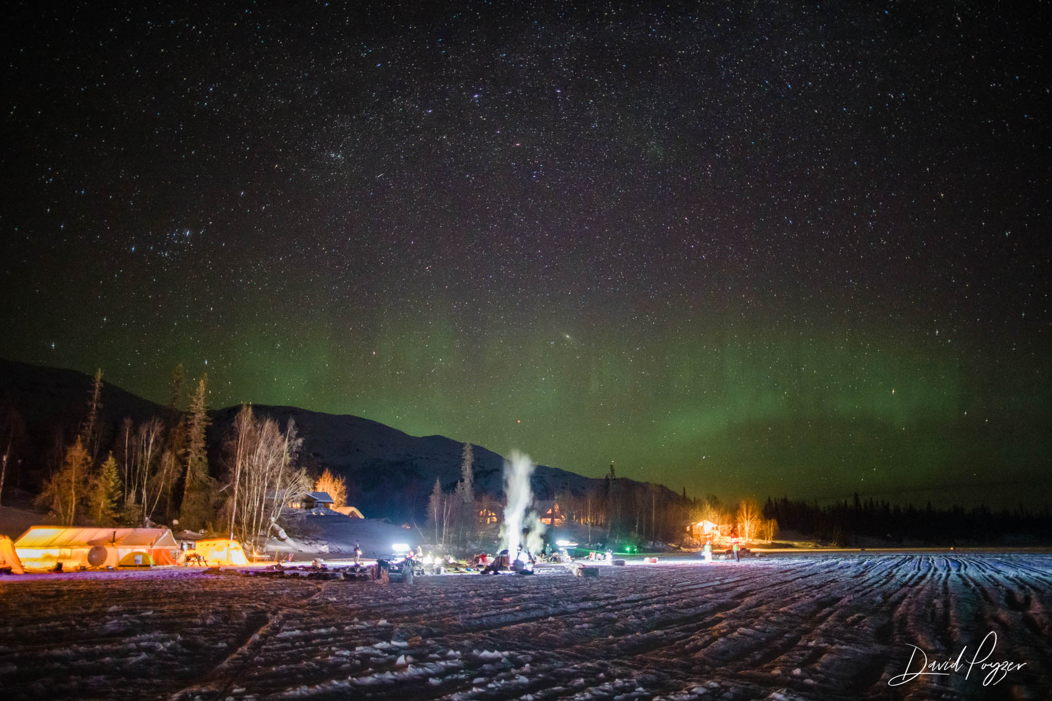 The aurora borealis dances over the dog lot at Finger Lake checkpoint.