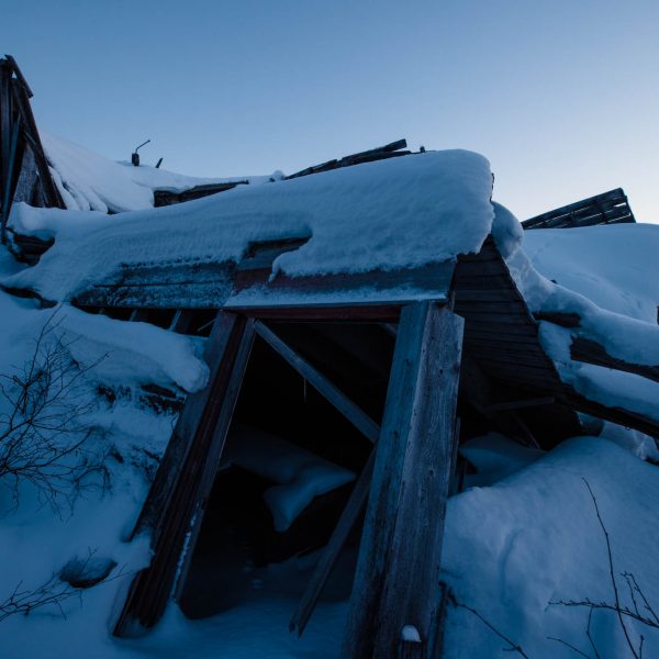 Snow covered ruins at Iditarod ghost town.