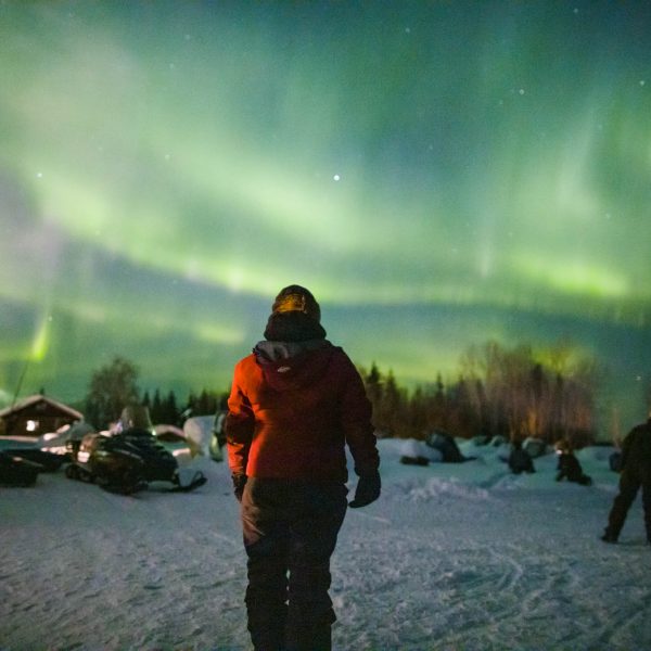 Northern lights, so bright they can be photographed without a tripod, dance over Nikolai.
