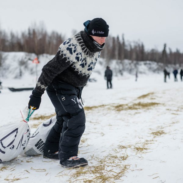 Dallas Seavey drags supplies back to his dog sled.