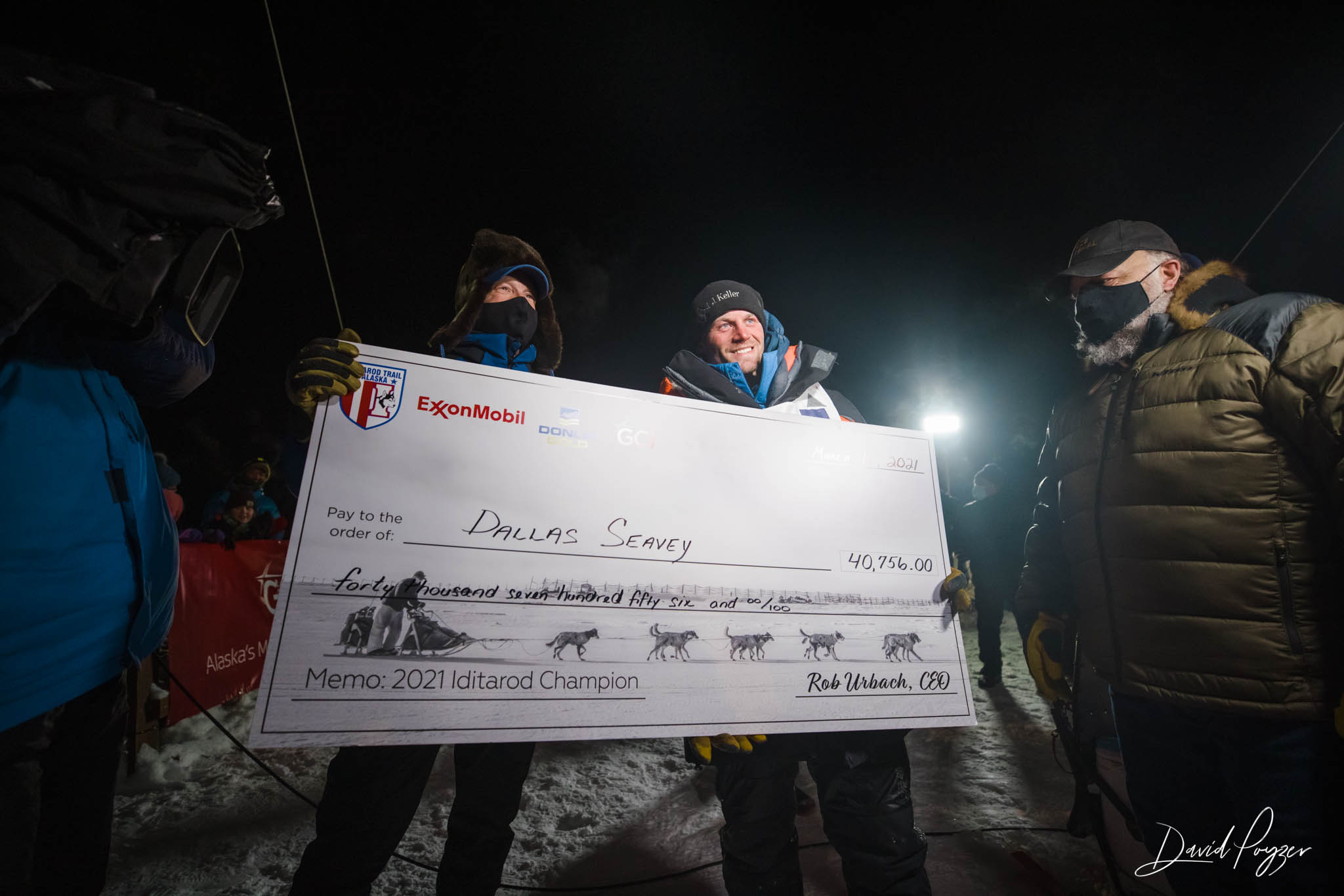 Iditarod 49 Champion, Dallas Seavey, receives check.