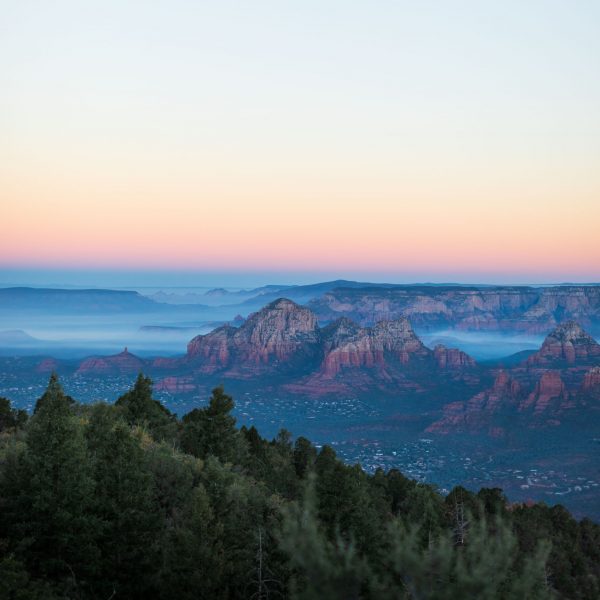 Capitol Butte in the Sedona Valley at sunrise with fog. Sedona, Arizona.